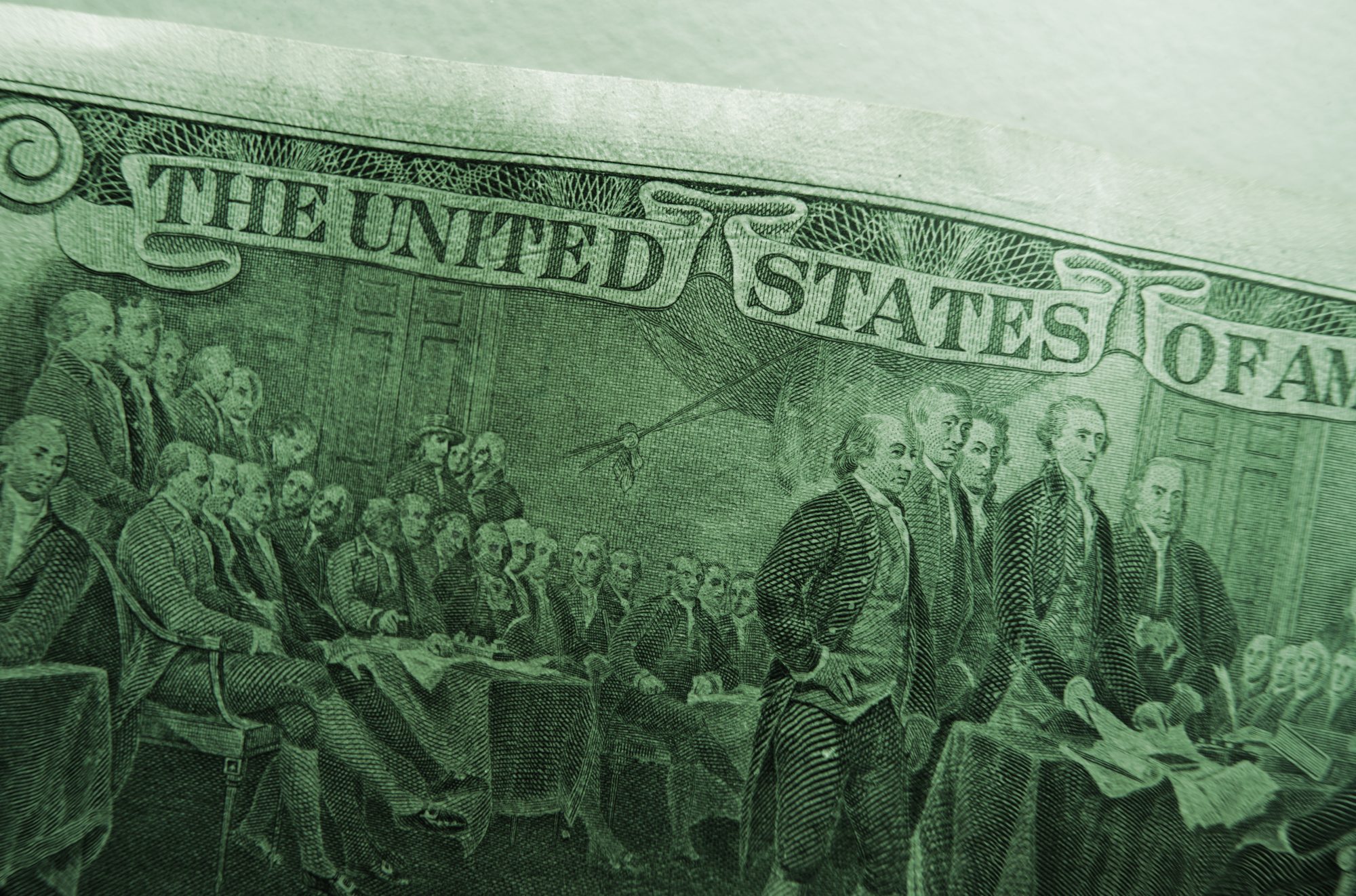 Image on the back side of a $2 bill depicting the Founding Fathers signing the Declaration of Independence in 1776